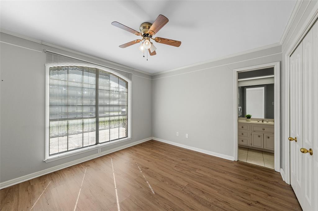 3601 Willow Bend Circle Waco, TX 76708 - Photo 27 of 37 an empty room with wooden floor fan and windows