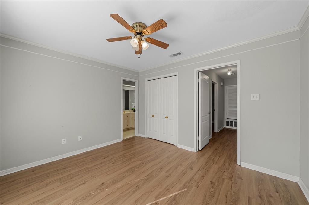 3601 Willow Bend Circle Waco, TX 76708 - Photo 28 of 37 an empty room with wooden floor and a ceiling fan