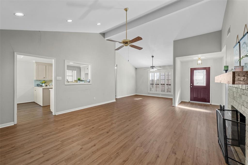 3601 Willow Bend Circle Waco, TX 76708 - Photo 7 of 37 a view of an empty room with window and wooden floor