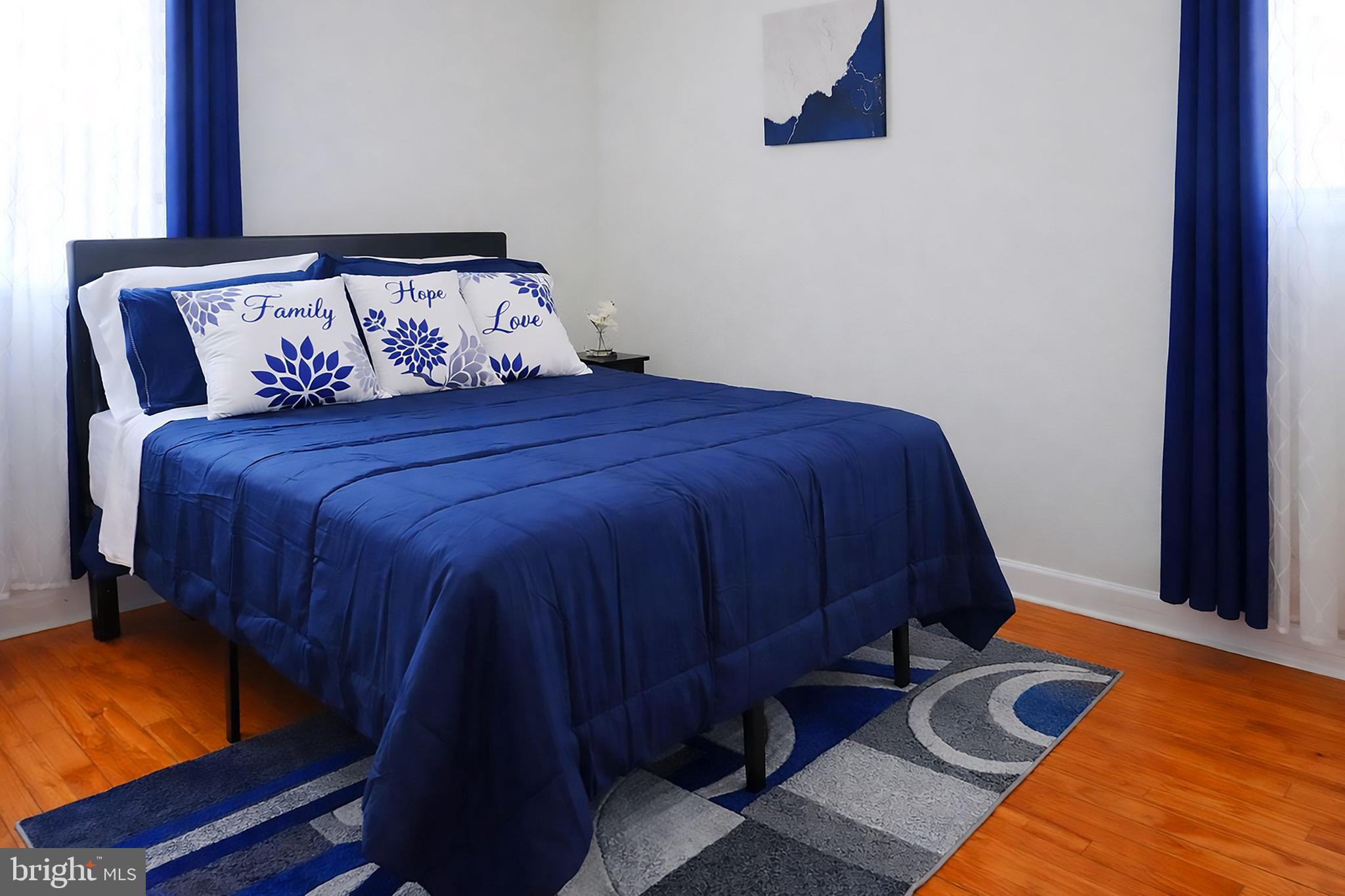 3935 Clay Place Northeast Washington, DC 20019 - Photo 8 of 17 a bed sitting in a bedroom next to a window