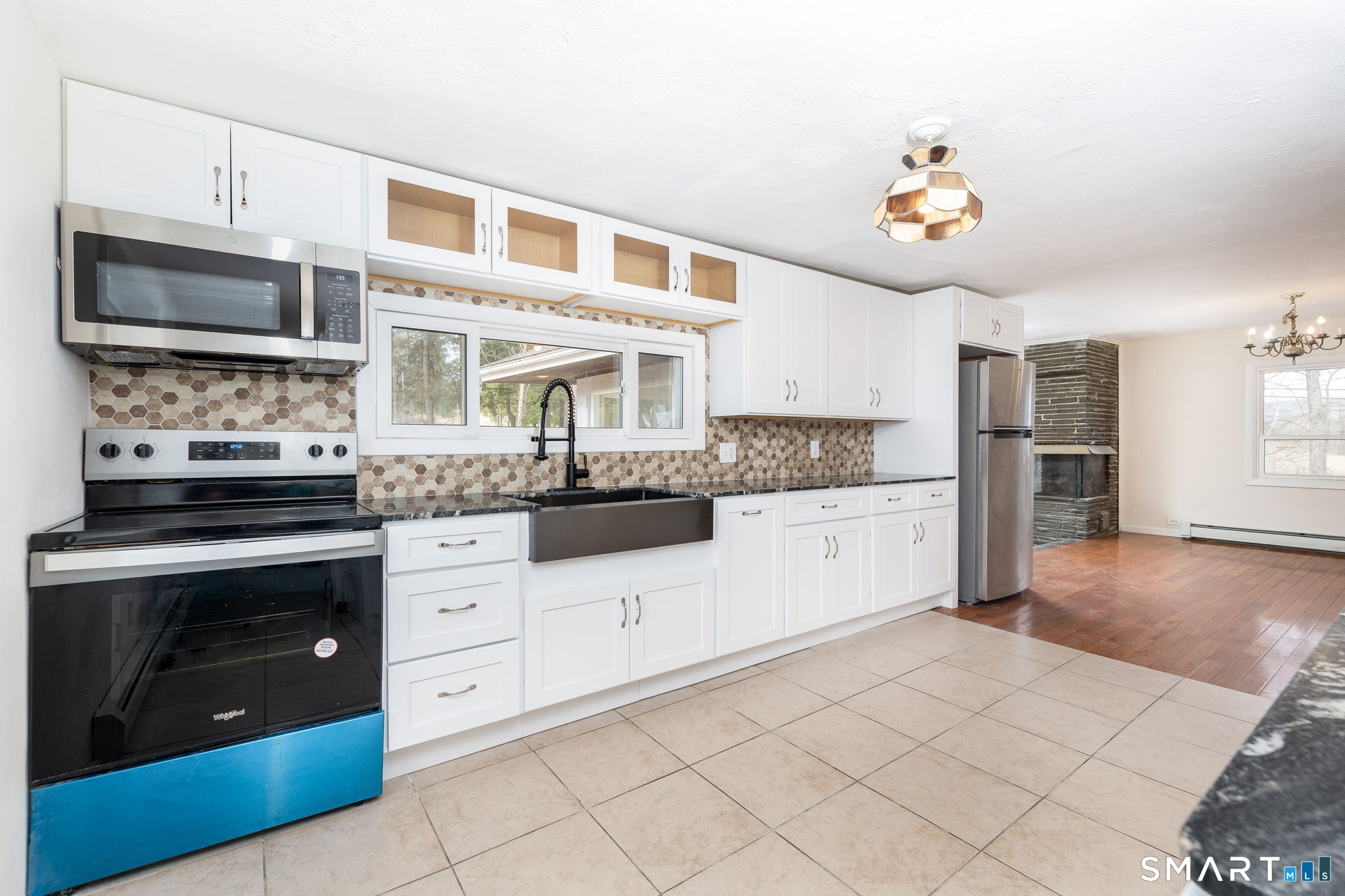 461 Pond Road Franklin, CT 06254 - Photo 12 of 35 a kitchen with stainless steel appliances granite countertop a stove and a microwave