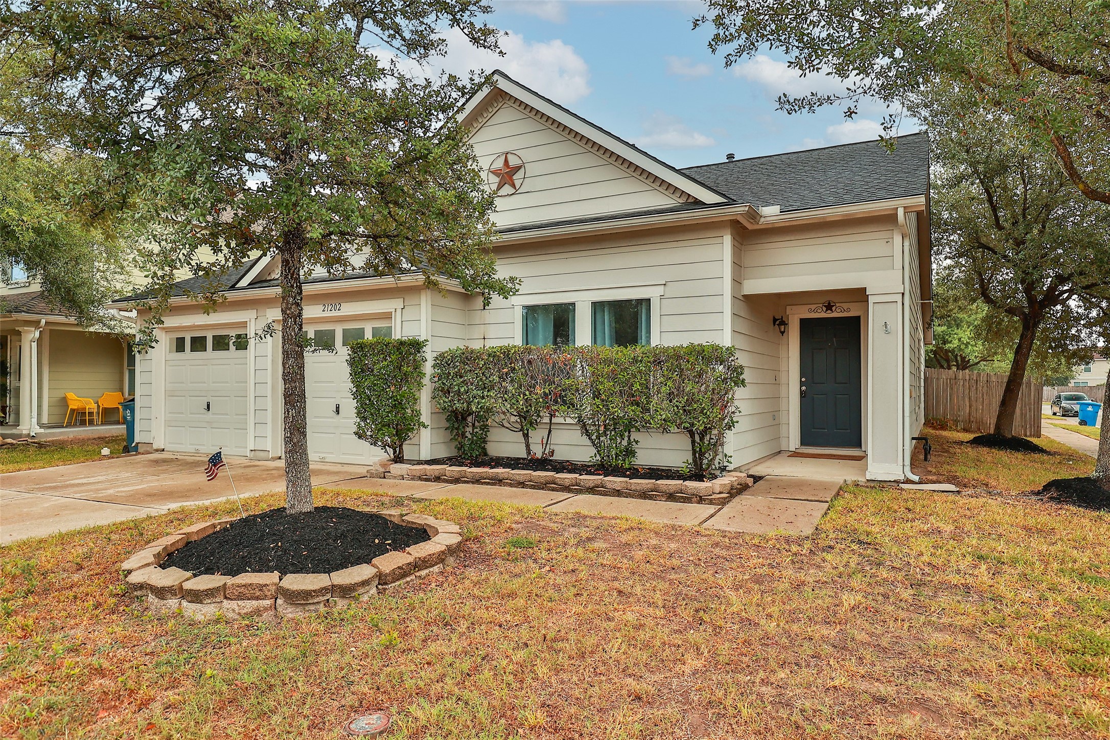 21202 Fire Wind Court Spring, TX 77379 - Photo 2 of 21 Charming Curb Appeal. Well-maintained single-story home with a classic brick exterior and a neatly landscaped front yard. 21202 Fire Wind Court, Spring, Texas, 77379