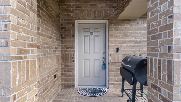 a view of a wooden door and chair