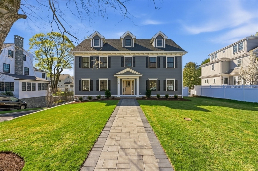 40 Foxcroft Road Winchester, MA 01890 - Photo 1 of 42 a front view of a building with a garden