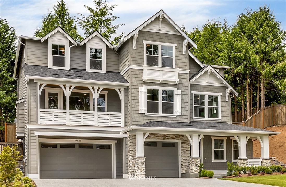 22921 31st Avenue Southeast Bothell, WA 98021 - Photo 1 of 16 a front view of a house with a yard