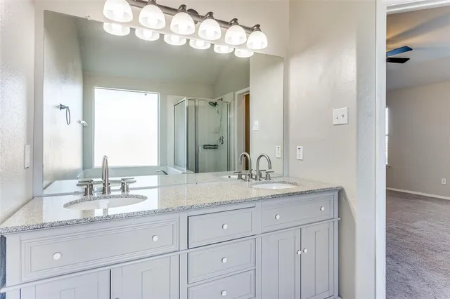 a white bath tub sitting next to a shower