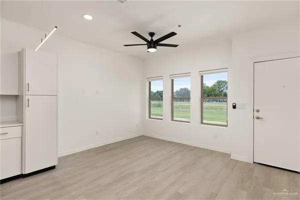 a view of an empty room with a window