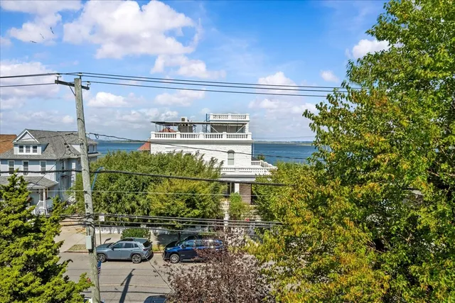 a bedroom with furniture and a wooden floor