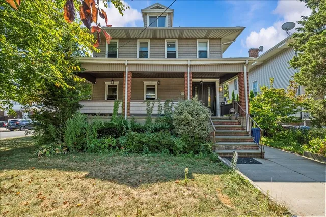 a view of a patio with table and chairs and potted plants
