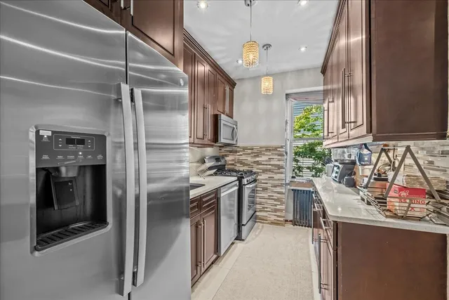 a dining room with wooden floor table and chairs