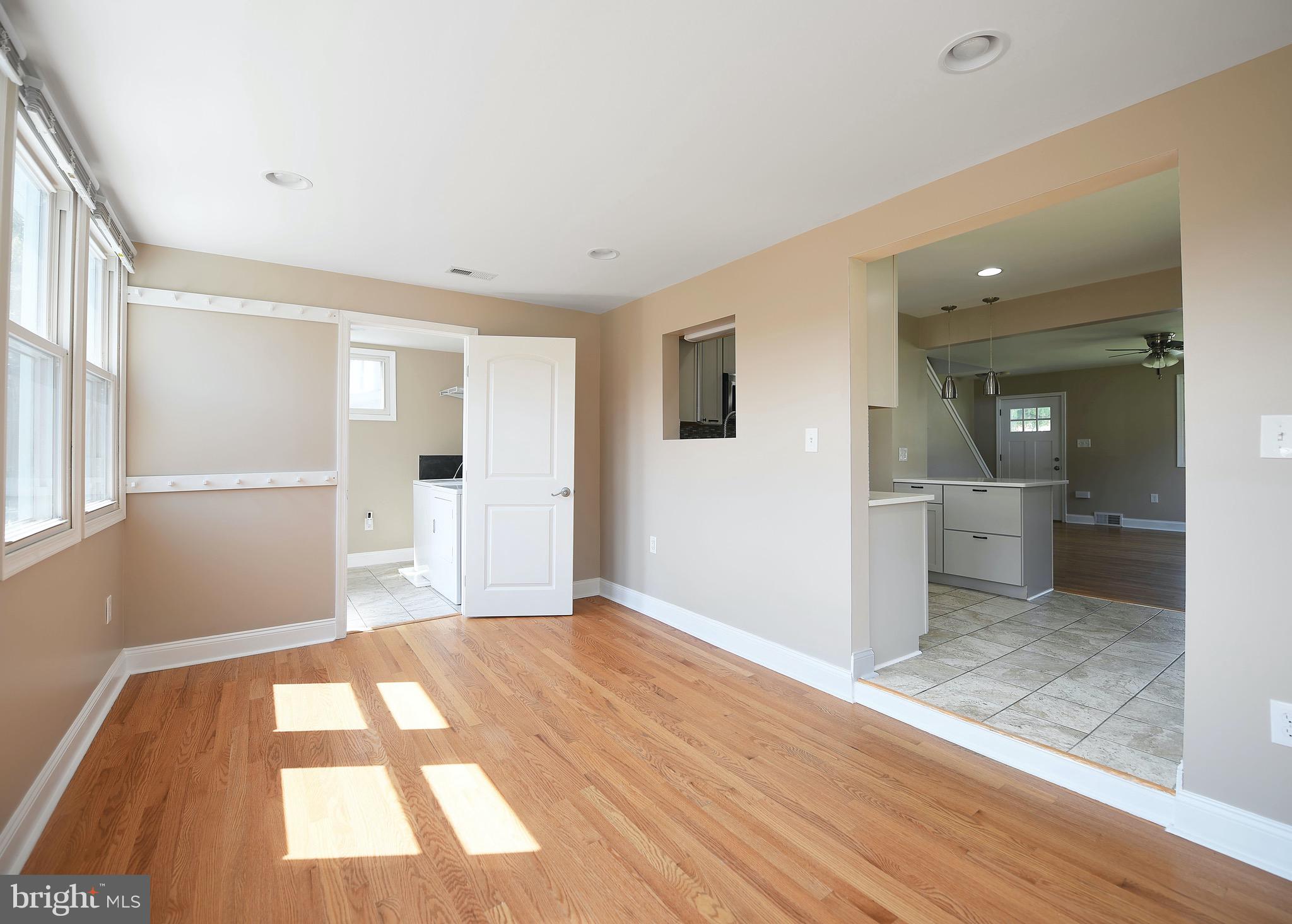 8205 Oakleigh Road Baltimore, MD 21234 - Photo 19 of 52 wooden floor in an empty room with a window