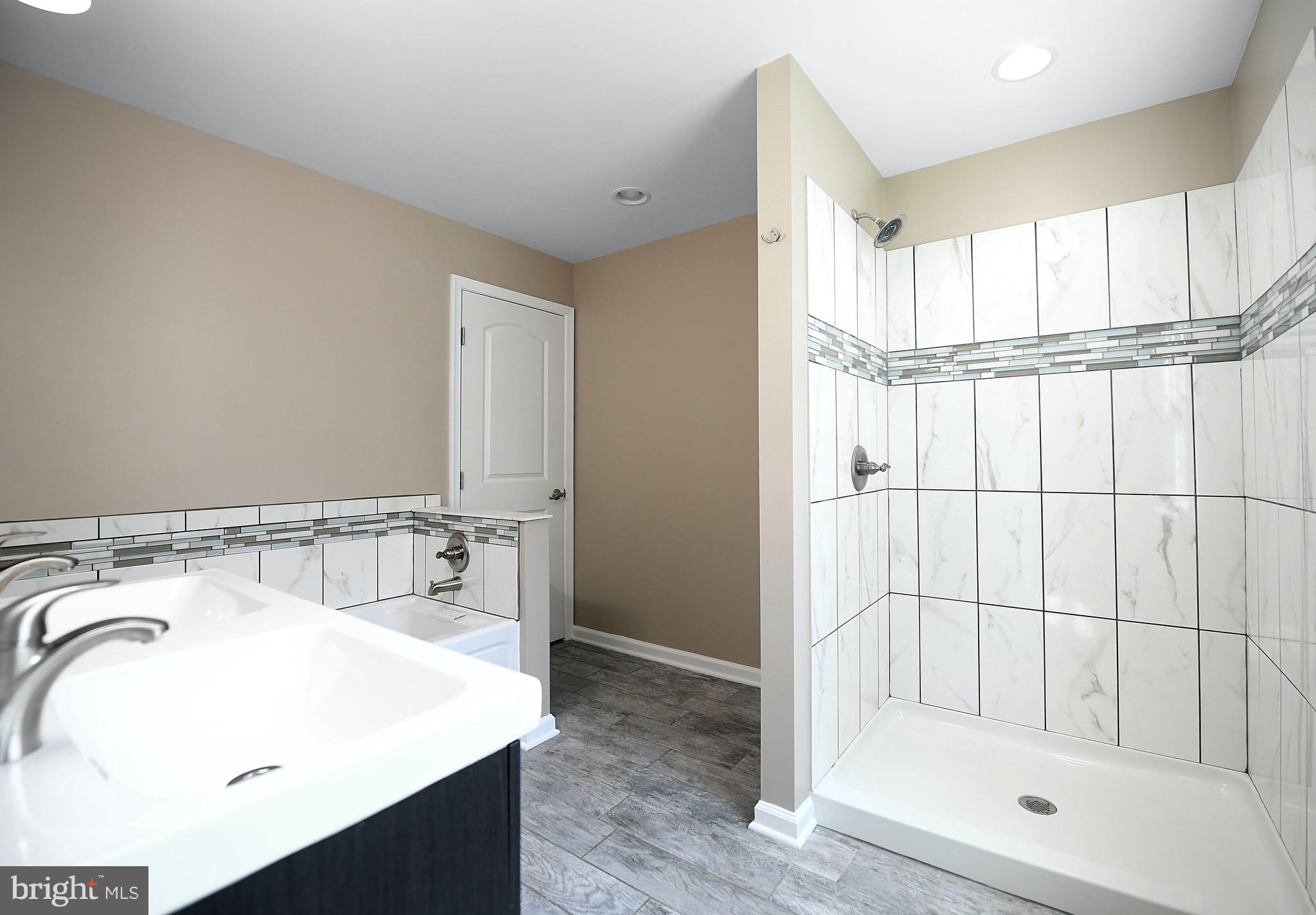 8205 Oakleigh Road Baltimore, MD 21234 - Photo 26 of 52 a bathroom with a tub and a sink