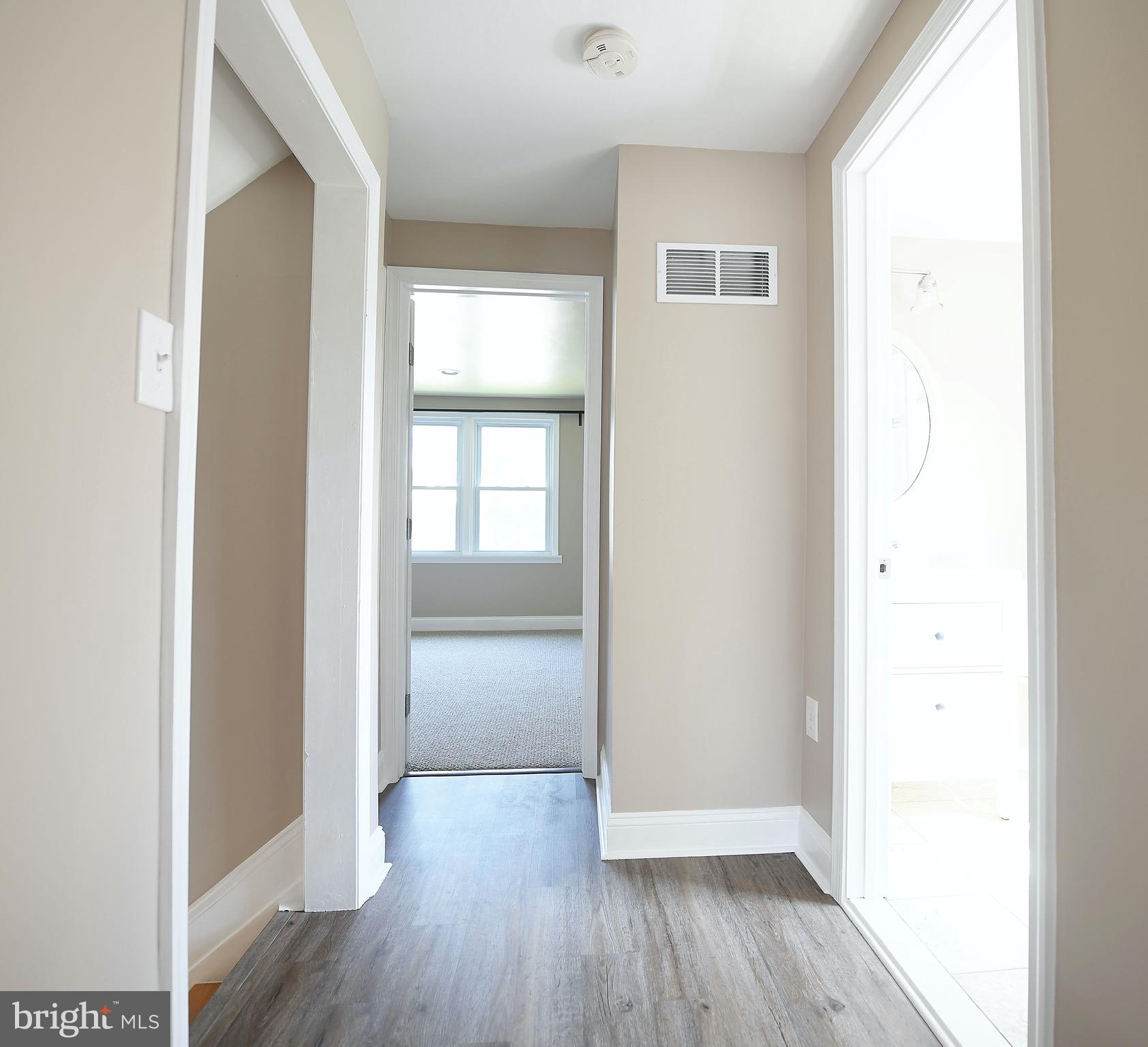8205 Oakleigh Road Baltimore, MD 21234 - Photo 31 of 52 a view of hallway with wooden floor