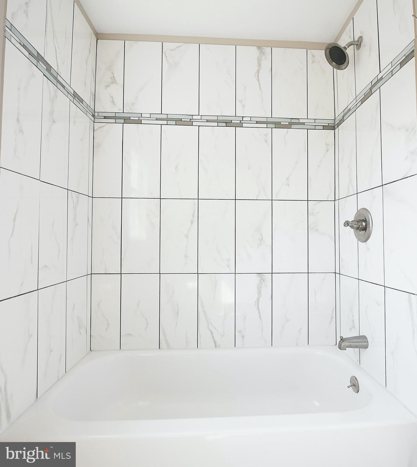 8205 Oakleigh Road Baltimore, MD 21234 - Photo 33 of 52 a bathroom with a bathtub