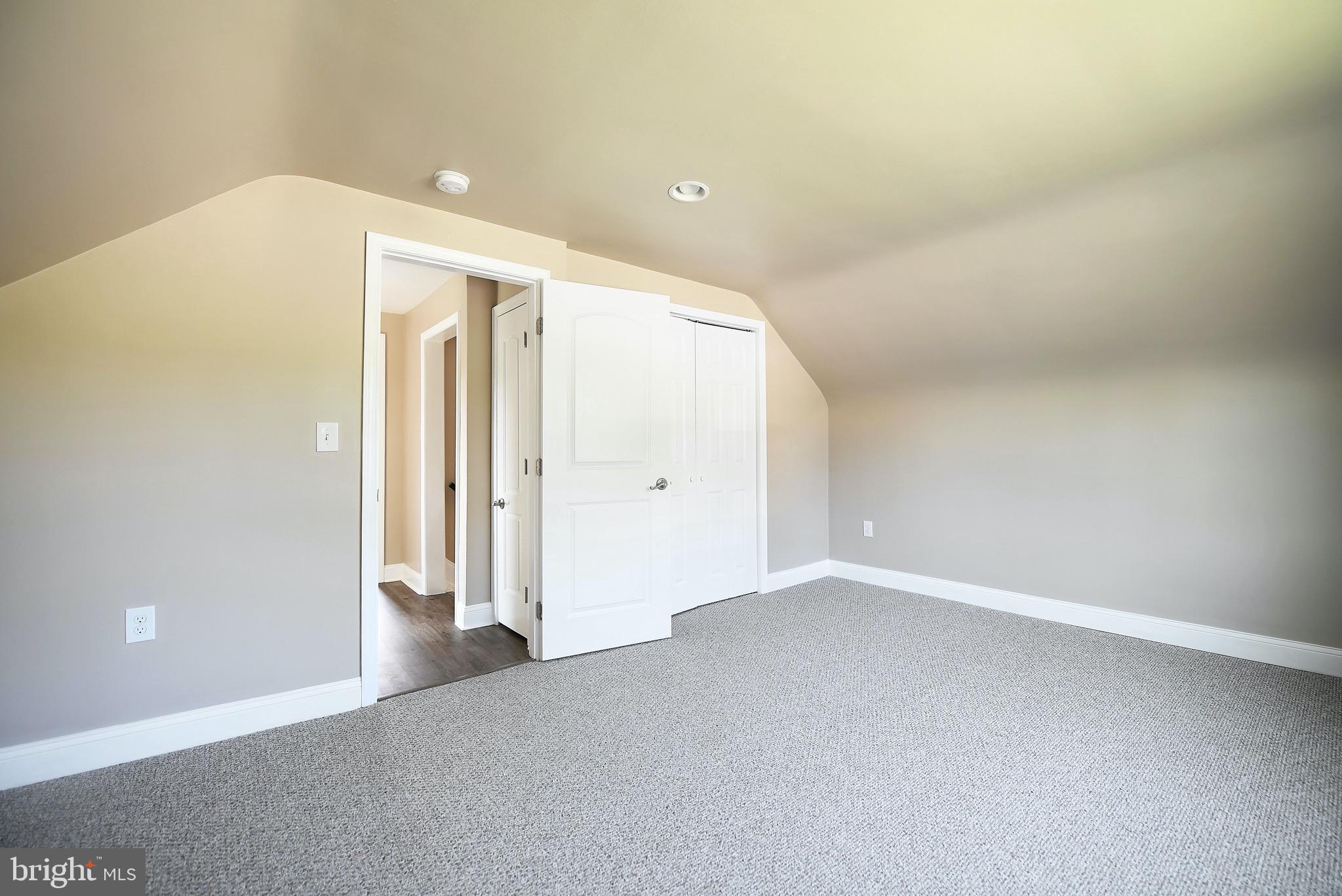 8205 Oakleigh Road Baltimore, MD 21234 - Photo 34 of 52 an empty room with closet and wooden floor