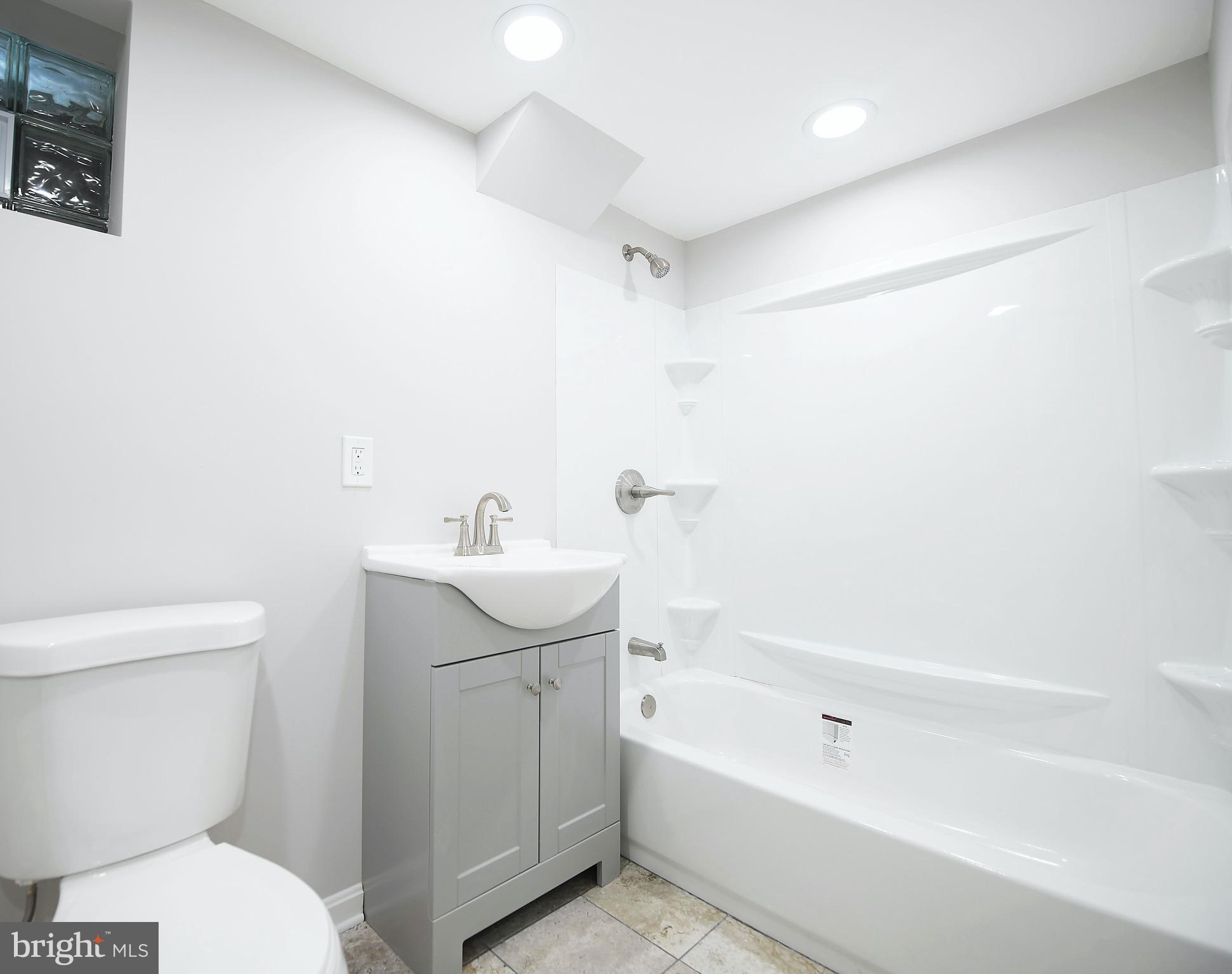 8205 Oakleigh Road Baltimore, MD 21234 - Photo 38 of 52 a bathroom with a sink a toilet and bathtub
