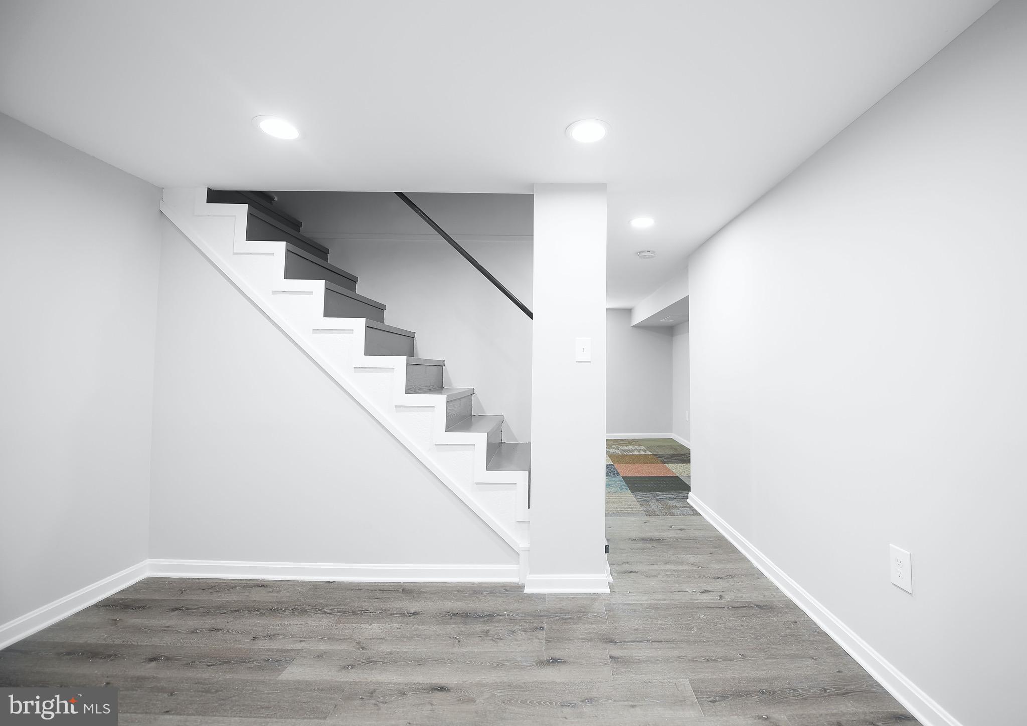 8205 Oakleigh Road Baltimore, MD 21234 - Photo 39 of 52 a view of entryway and hall with wooden floor