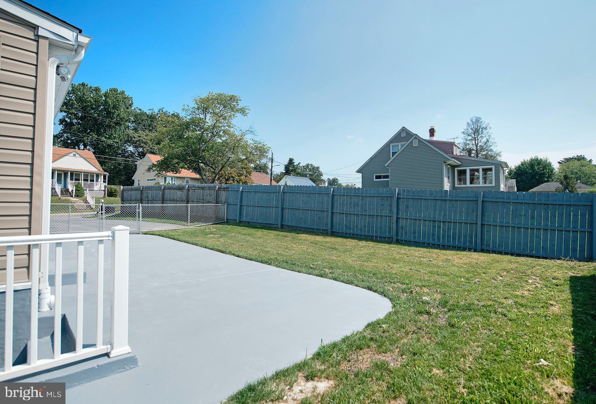 8205 Oakleigh Road Baltimore, MD 21234 - Photo 46 of 52 a view of a backyard with wooden fence