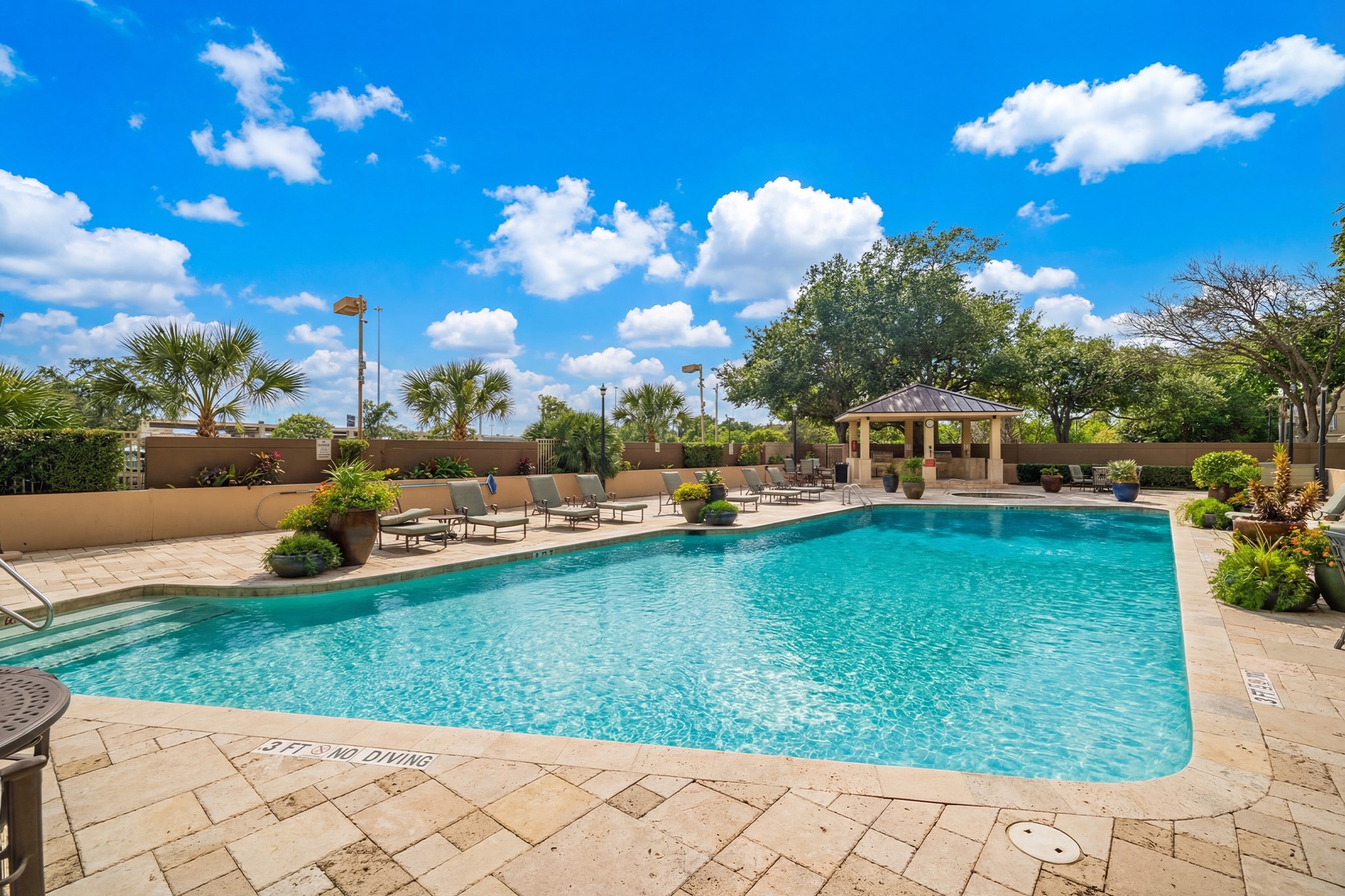3525 Sage Road, Unit 1016 Houston, TX 77056 - Photo 13 of 42 a view of a garden with lawn chairs