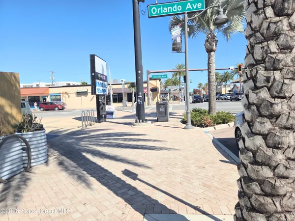 a view of walk in closet with clothes