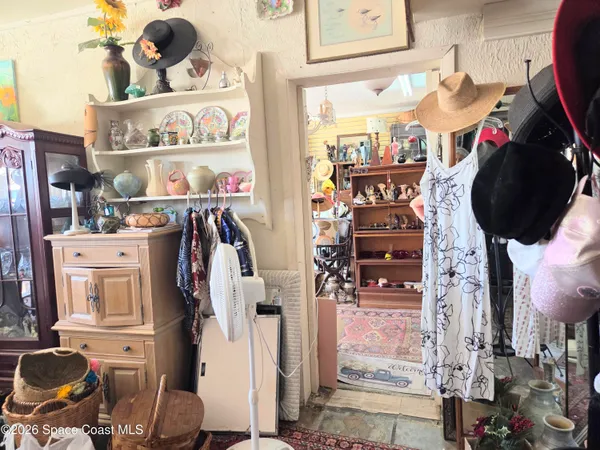 walk in closet with clothes and shoes