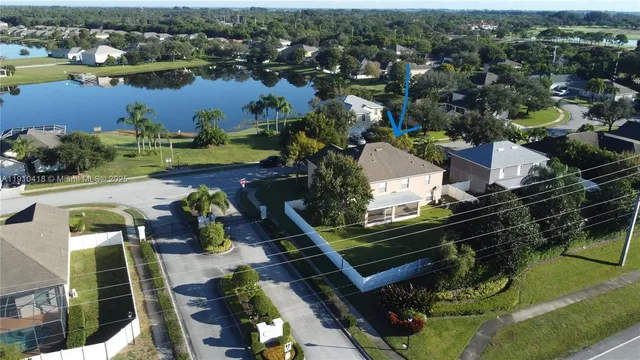 an aerial view of a house with outdoor space