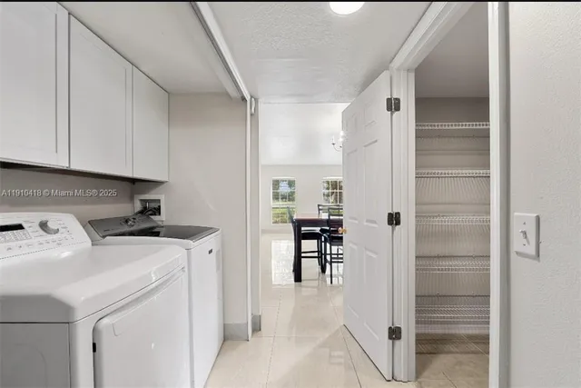 a view of hallway with washer and dryer