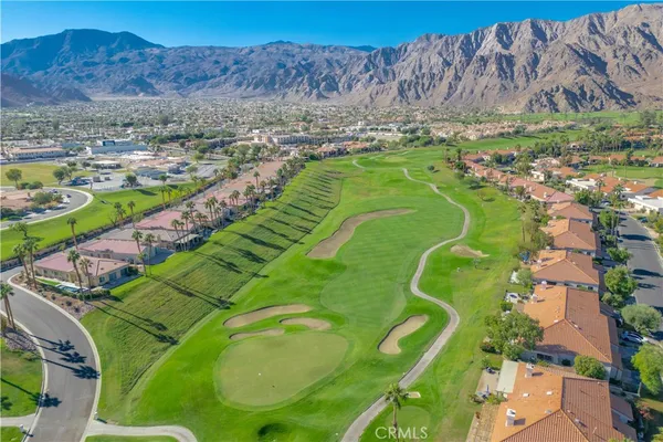 a view of a swimming pool with a yard