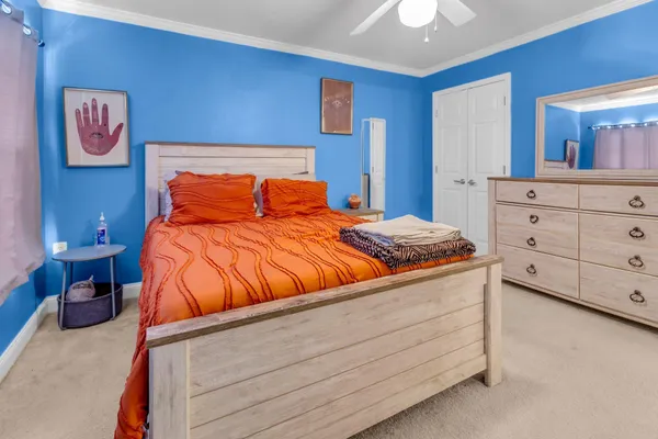 a bedroom with a bed and closet