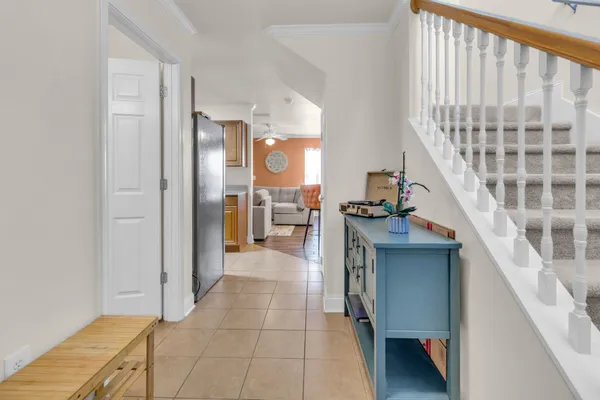 a view of entryway and kitchen