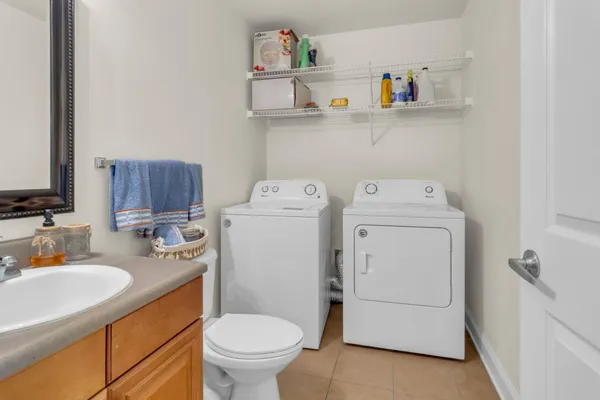 a bathroom with a sink toilet and vanity