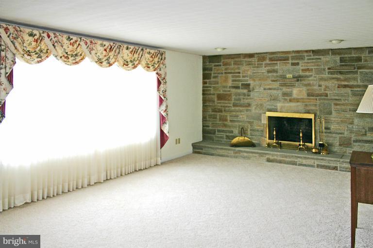 4603 Lower Beckleysville Road Hampstead, MD 21074 - Photo 1 of 28 Living Room with wood-burning fireplace.