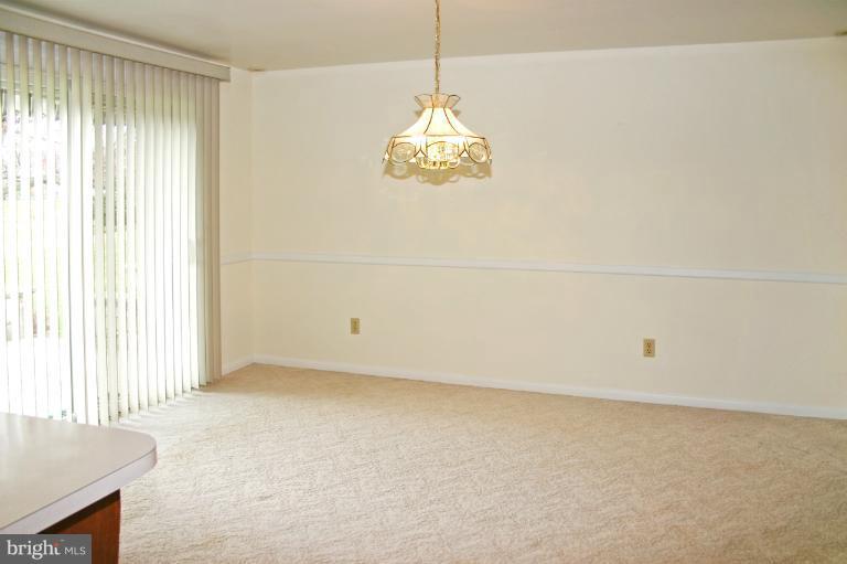 4603 Lower Beckleysville Road Hampstead, MD 21074 - Photo 16 of 28 The dining room has sliders to the stone patio.