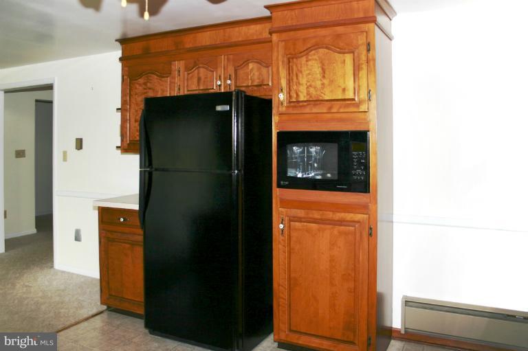 4603 Lower Beckleysville Road Hampstead, MD 21074 - Photo 20 of 28 The kitchen has a built-in microwave and fridge.