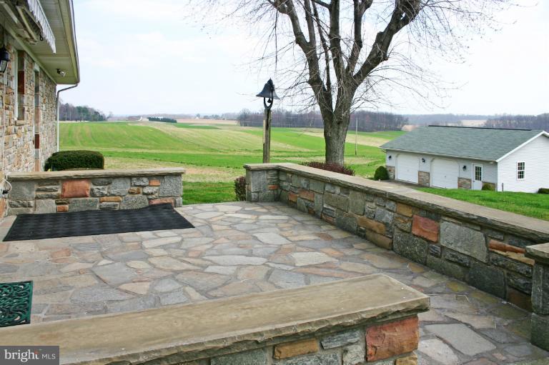 4603 Lower Beckleysville Road Hampstead, MD 21074 - Photo 6 of 28 A lovely stone patio is at the rear of the home.