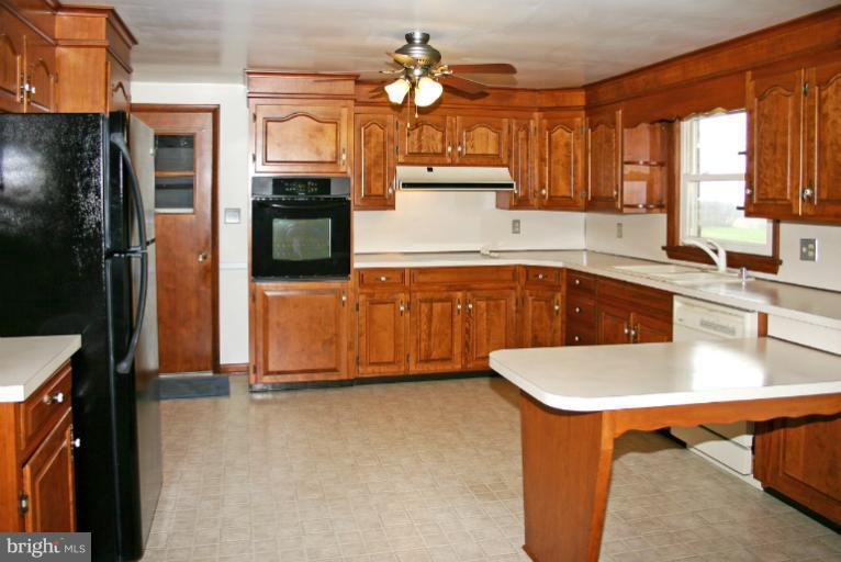 4603 Lower Beckleysville Road Hampstead, MD 21074 - Photo 7 of 28 Bright kitchen with nice wood cabinets.