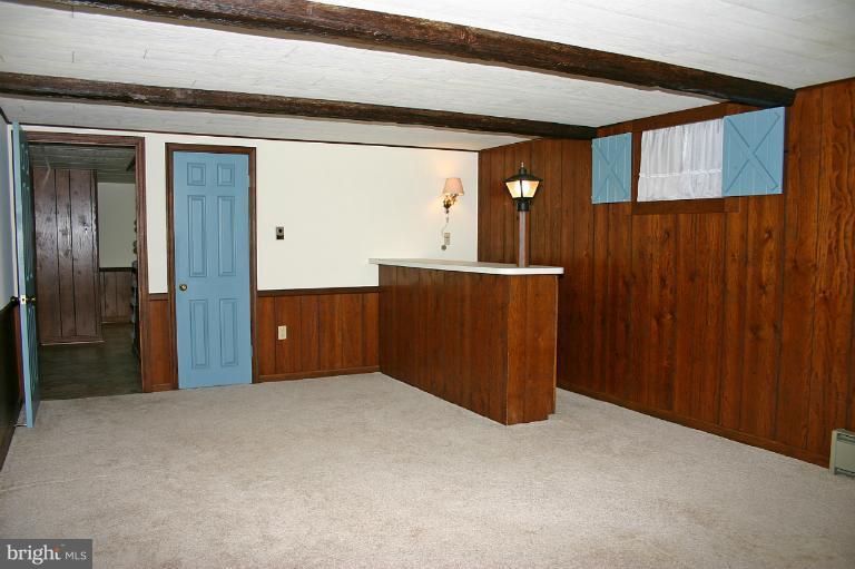 4603 Lower Beckleysville Road Hampstead, MD 21074 - Photo 10 of 28 There are also faux wood beams and a bar.