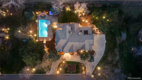 a view of a house with a yard and tree s