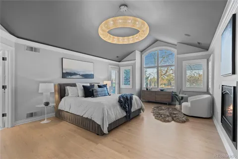 a bedroom with a bed couch and a window