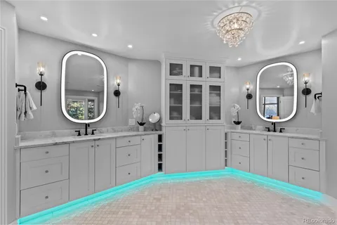 a spacious bathroom with a mirror a sink and a mirror