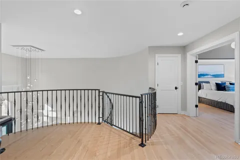 a view of a room with wooden floor