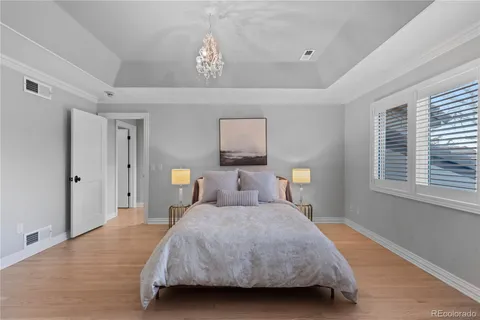 a bedroom with a bed and a lamp