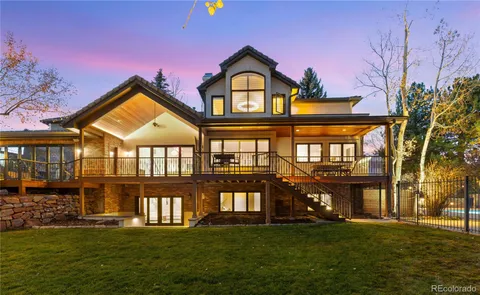 a front view of a building with a garden