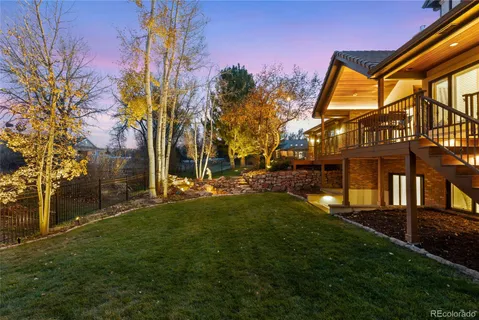 a view of backyard of house with green space