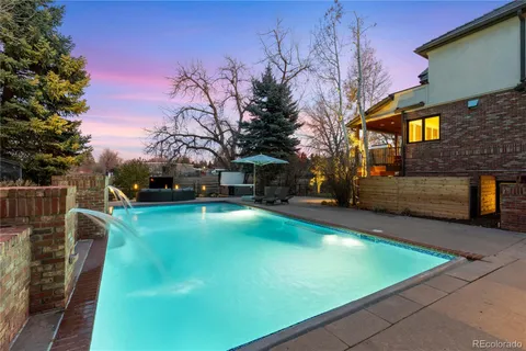 a view of a yard with swimming pool