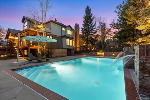 a view of a yard with swimming pool