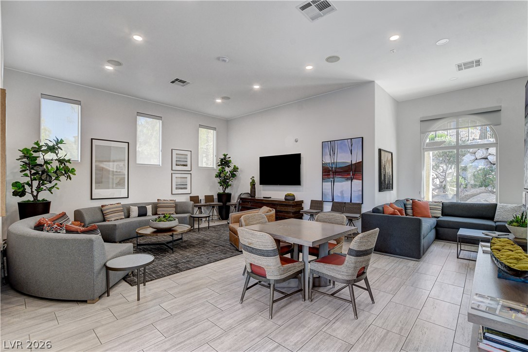 2555 Hampton Road, Unit 2207 Henderson, NV 89052 - Photo 68 of 74 A spacious common area with recessed lighting, tile flooring, and large windows creates an inviting atmosphere.