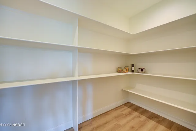 a view of an empty walk in closet