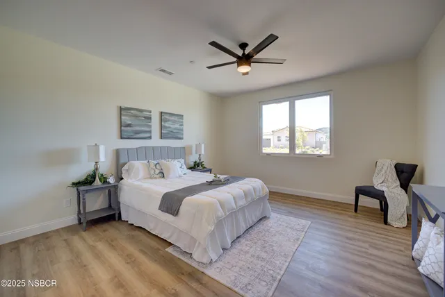 a bed room with a bed and a window