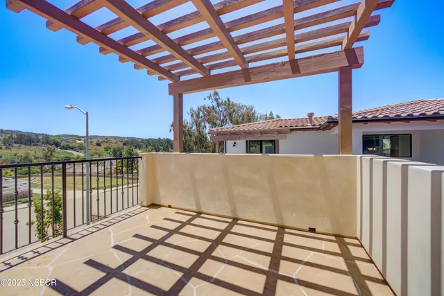 a view of a balcony with wooden floor